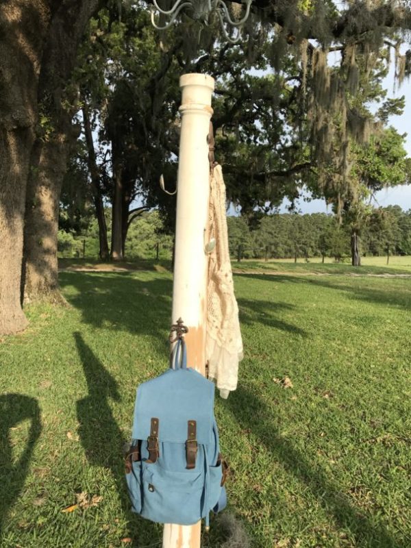 Repurposed antique column into coat rack