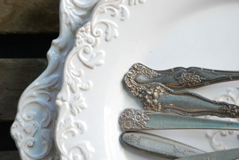 White dishes with antique spoon handles