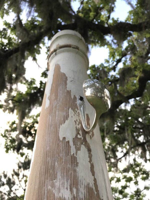 Antique and repurposed column with silver spoon