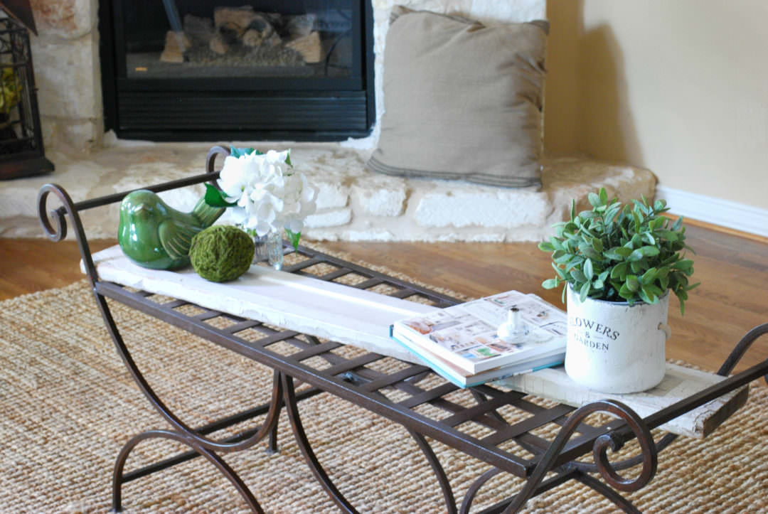 garden bench used as a coffee table refresh with chippy painted board and accessories