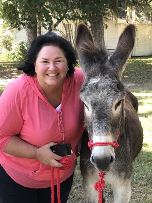 BLM burro and owner in new surroundings
