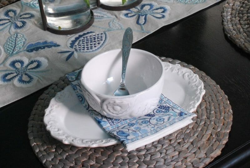 Oval luncheon plate with blue and white napkin and owl bowl