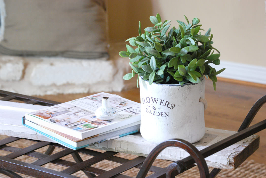 iron bench coffee table with books and doorknob