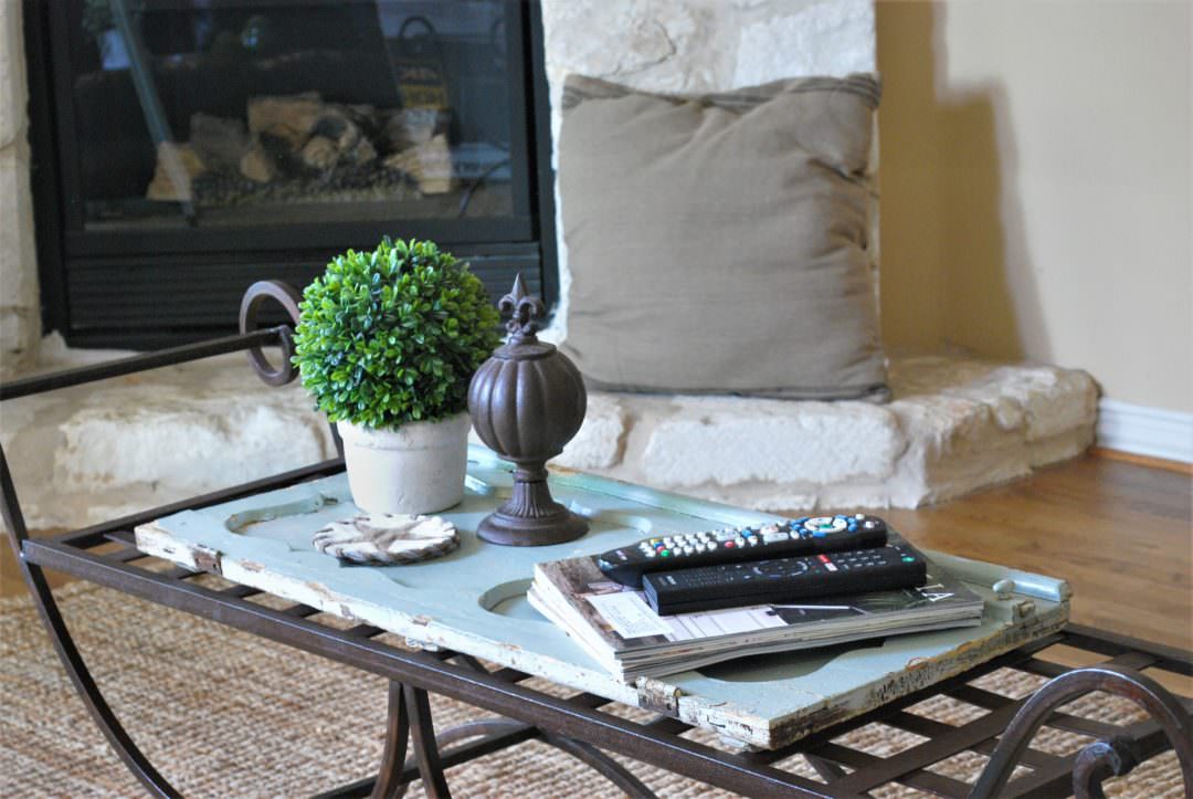 iron garden bench with old cabinet door in a coffee table refresh