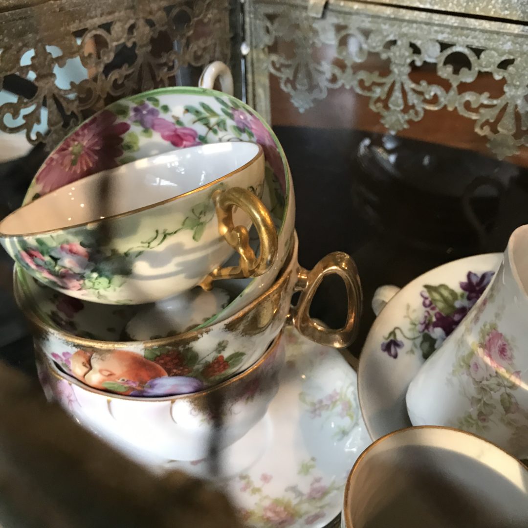 Stacked antique cups and saucers 