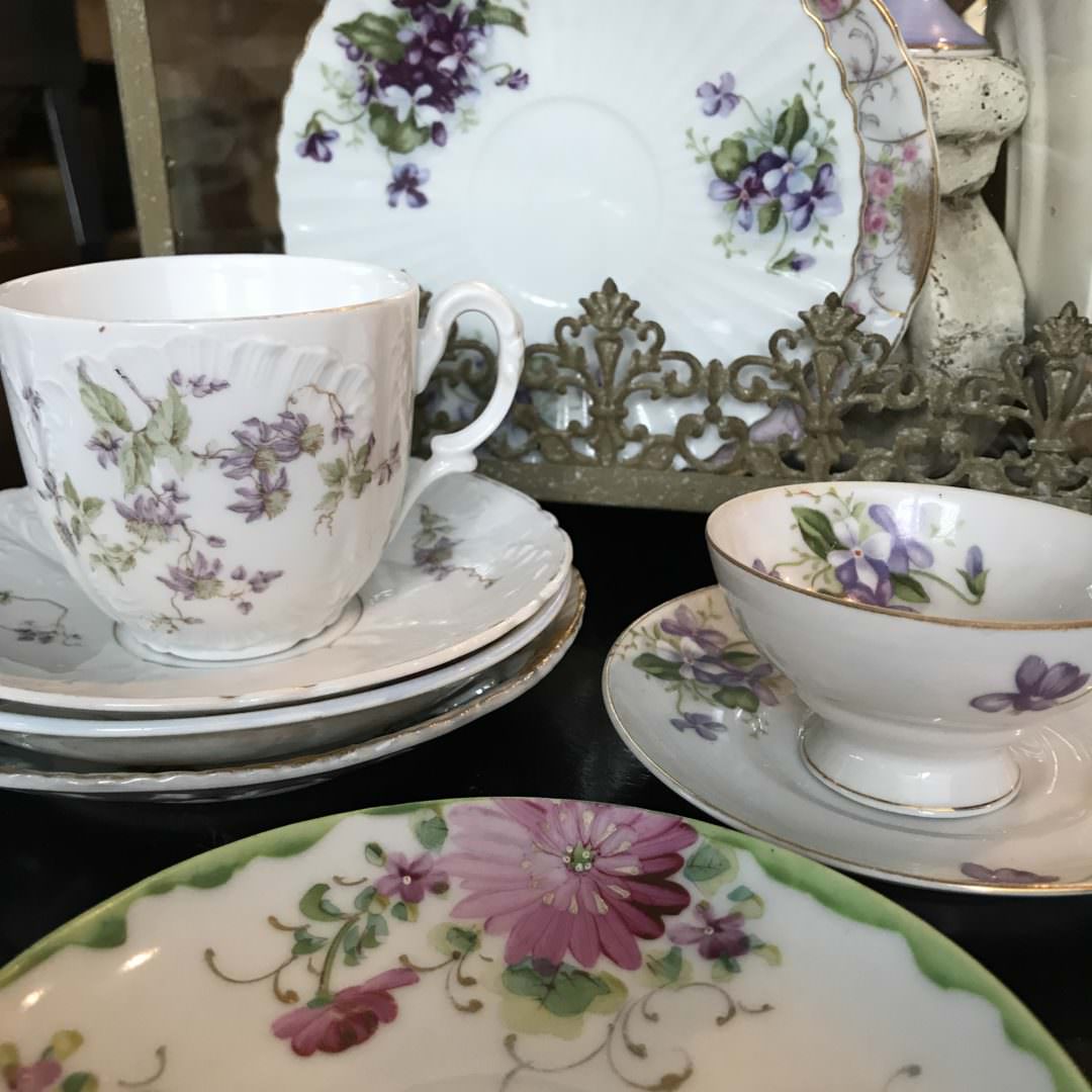 brightly colored vintage teacups and saucers 