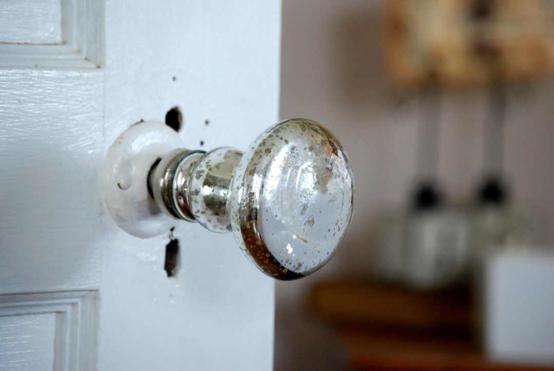 Mercury glass door knob in the farmhouse bedroom