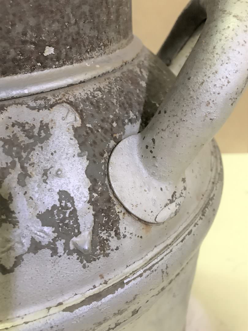 vintage milk can handle with rust before painting