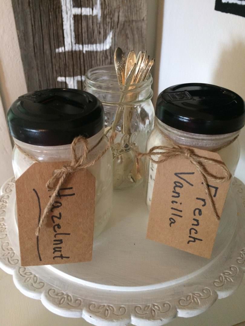 Ball jars with Coffee-Mate creamer lids painted black for a better farmhouse style look