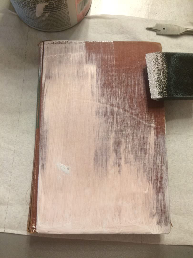 Painted book with Glidden Paint with Primer that didn't work even after 5 coats