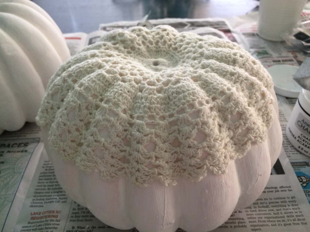Glue on a fabric doily or a vintage looking pumpkin