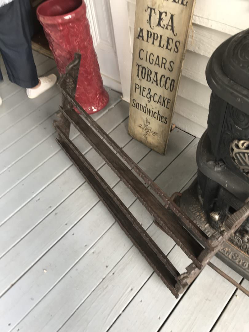 antique plate holder can be repurposed into a gift wrapping station or hold a collection of baseballs or wine bottles