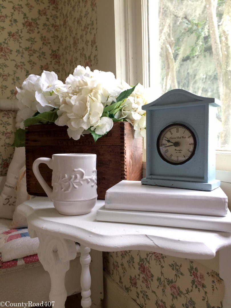 Vignette of antique box with hydrangeas by Countyroad407.com