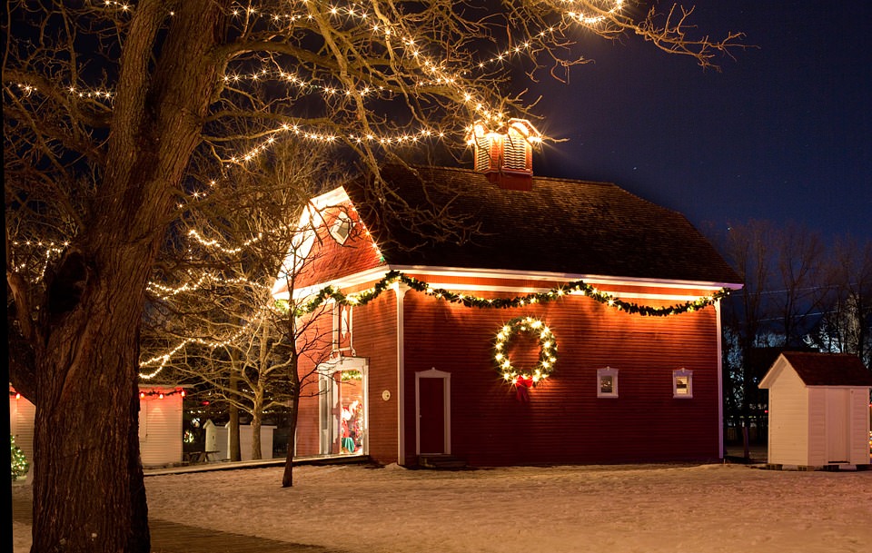 barn with Christmas lights and snow