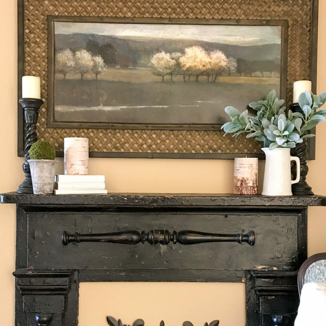 Layering is one way to decorate a mantel. Check out the east steps by CountyRoad407.com