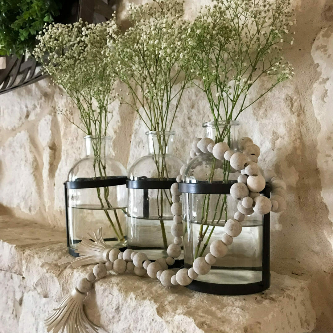 Glass vases with wood beads and baby's breath