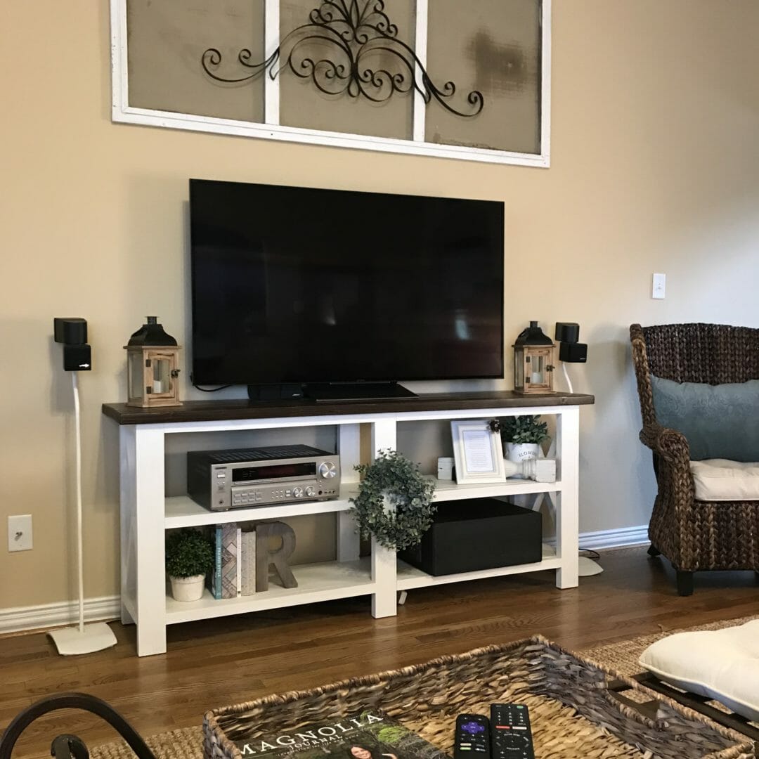 Easy tips for styling a TV console table around the ugly necessary boxes. CountyRoad407.com