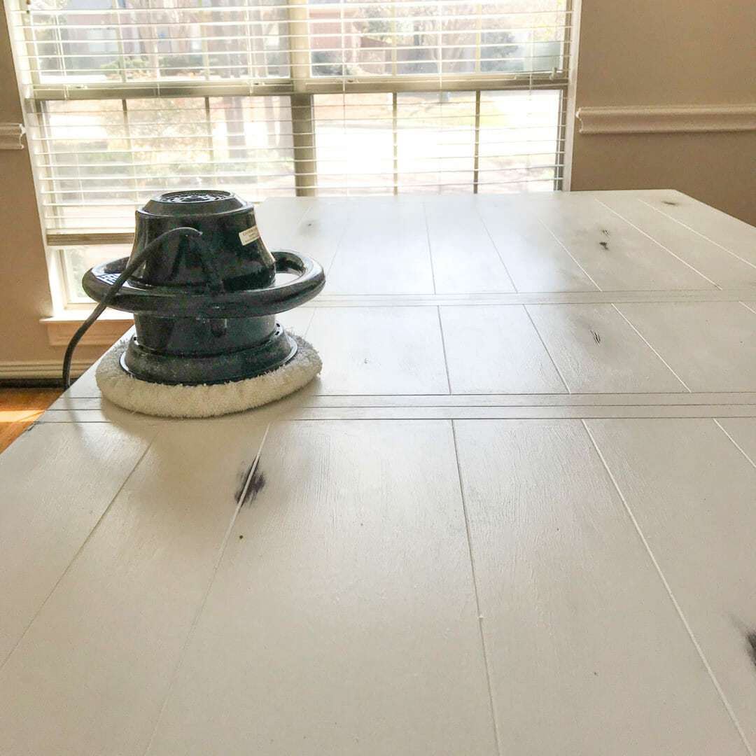 Buffing the wax on a dining table with Rustoleum Chalk paint by Countyroad407.com