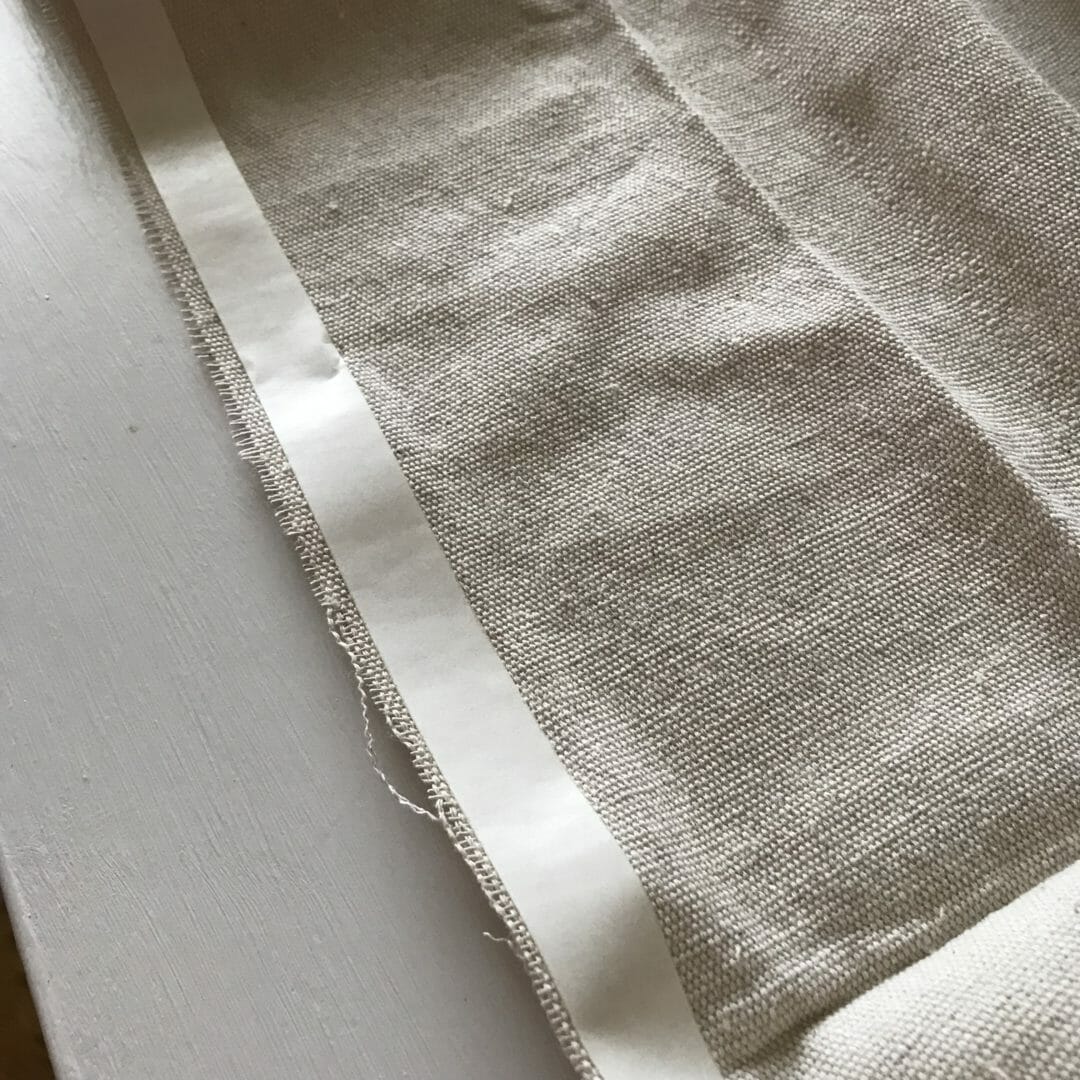 Using heavy duty double sided tape to make drop cloth curtains from COuntyroad407.com