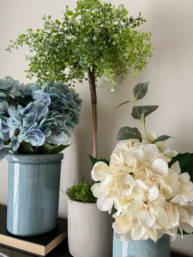 topiary with hydrangeas in blue crocks