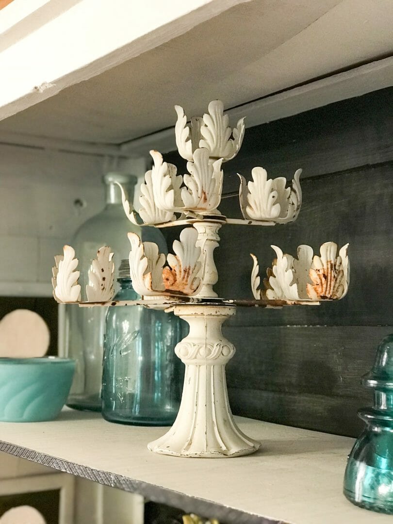 a vintage candleabra finds its place in a summer dining hutch mini makeover by countyroad407.com