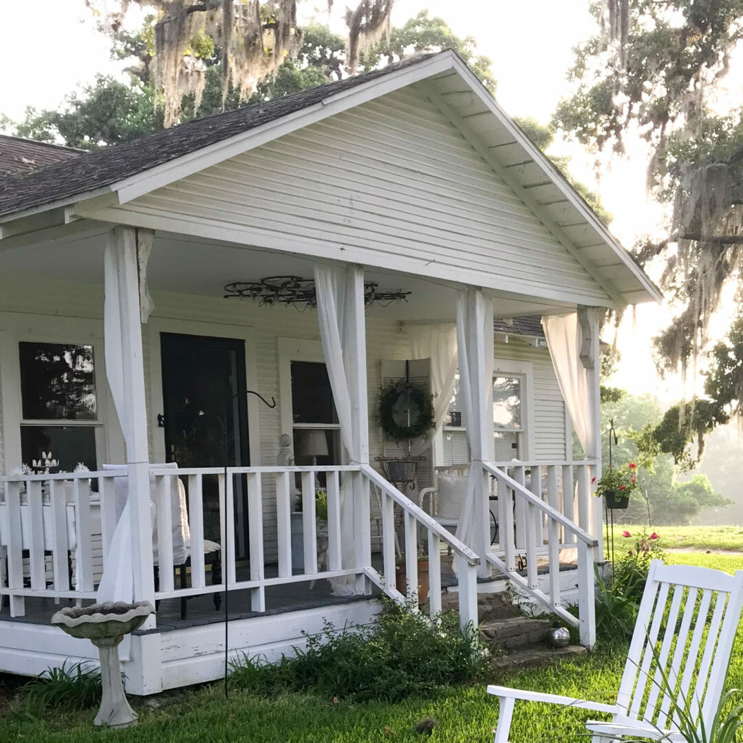 Farmhouse front porch with Dollar store curtains! By countyroad407.com