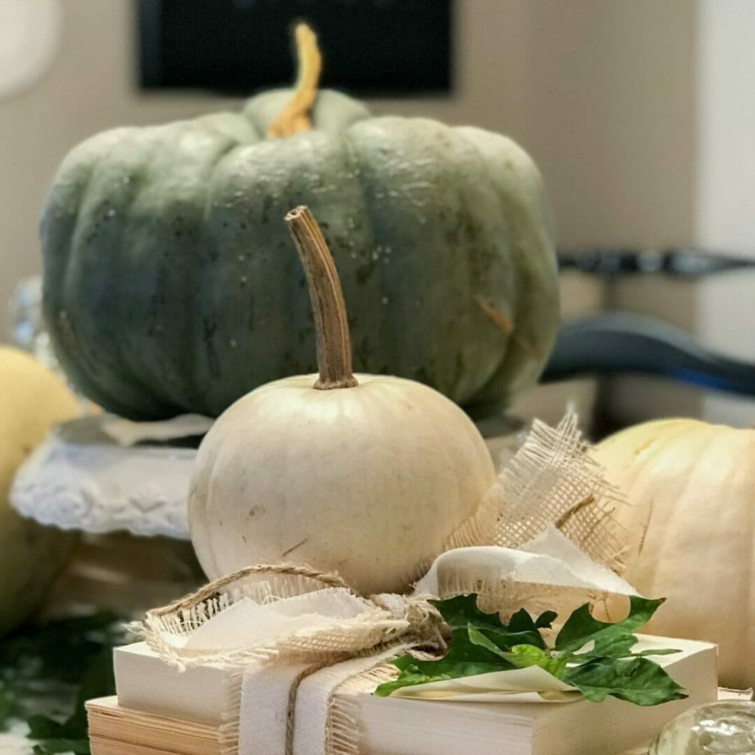 Pumpkins and vintage items make a great neutral fall tablescape by CountyRoad407.com