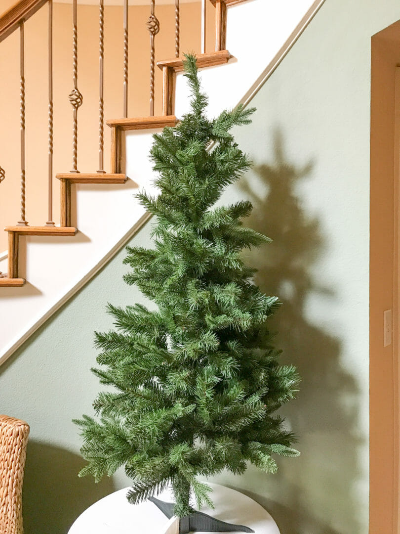 empty Christmas tree turns woodland tree by CountyRoad407.com