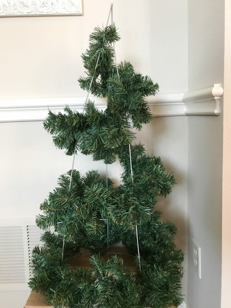 Step 2 for making your own Christmas tree with faux garland. by COuntyRoad407.com #DIYchristmasTree #ChristmasDecor #outdoorChristmasdecor
