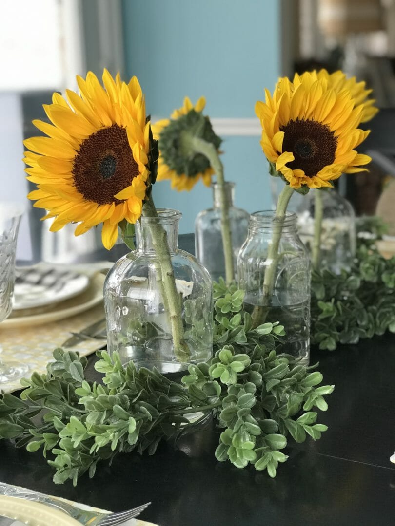 sunflowers in clear jars
