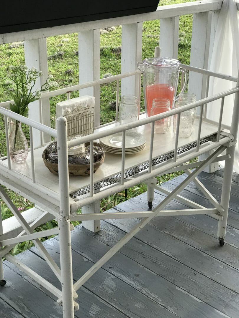 Vintage baby bed used as serving table