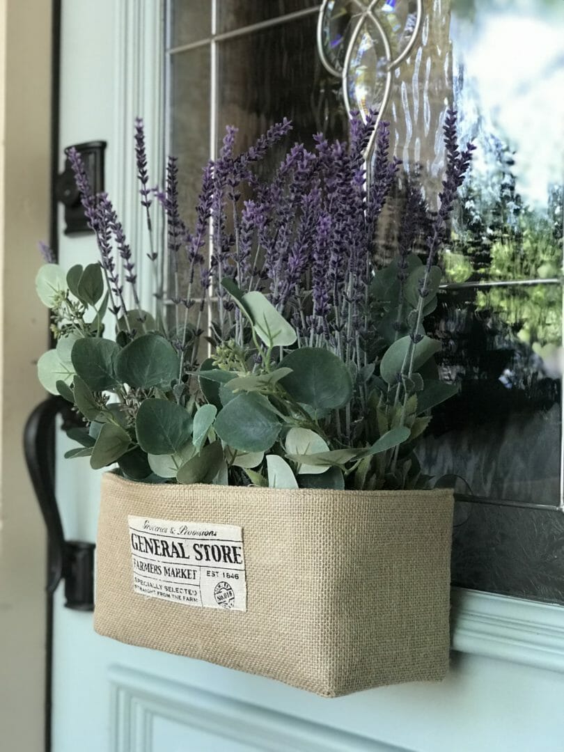 Spring Door Decor with burlap box and purple flowers hanging on front door