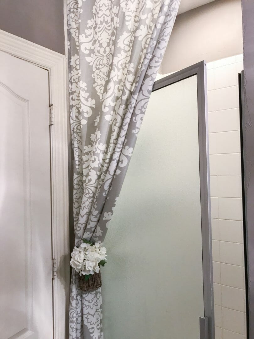 decorative curtain with flower basket and shower door