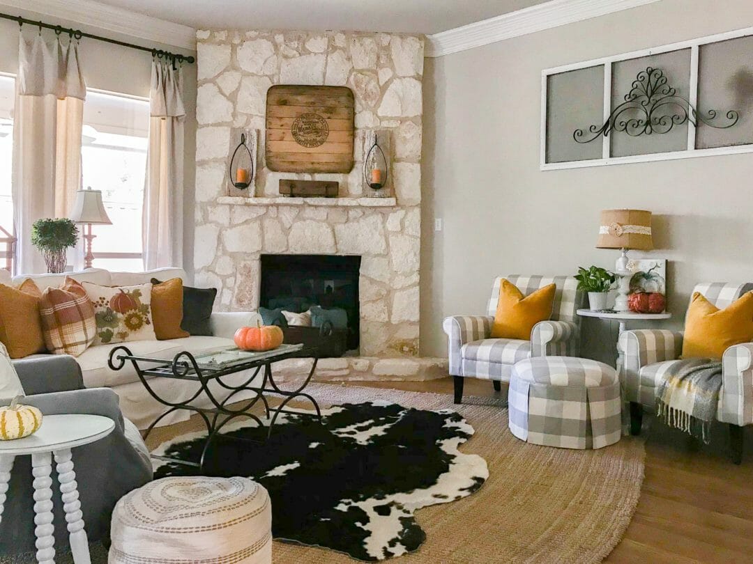 family room with rugs, sofa, chairs and mantel