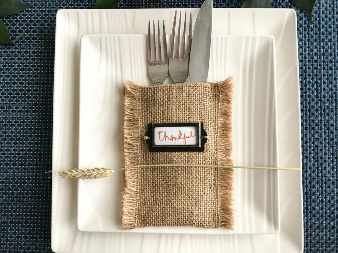 white plates with burlap pocket