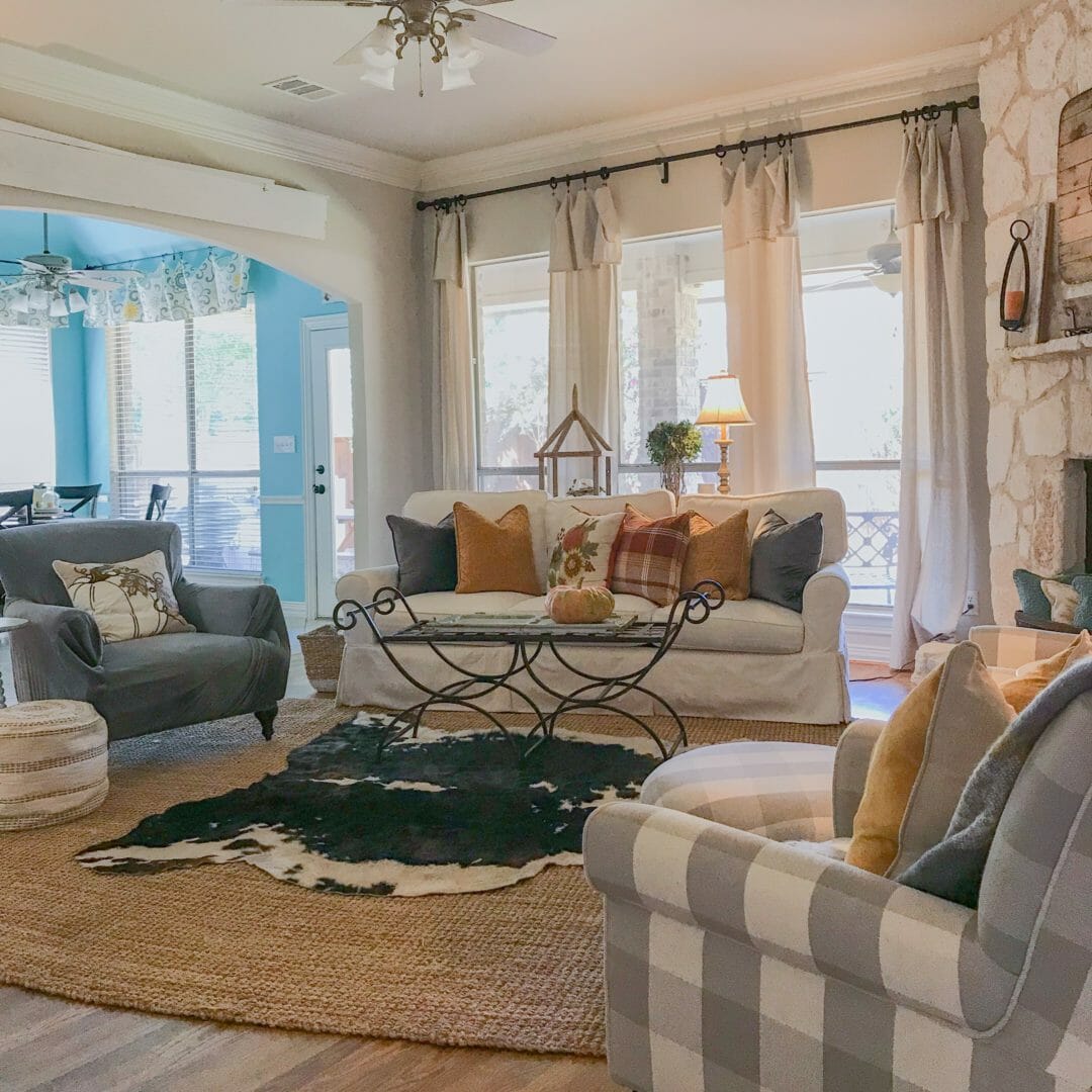 family room with cowhide rug, sofa and chairs