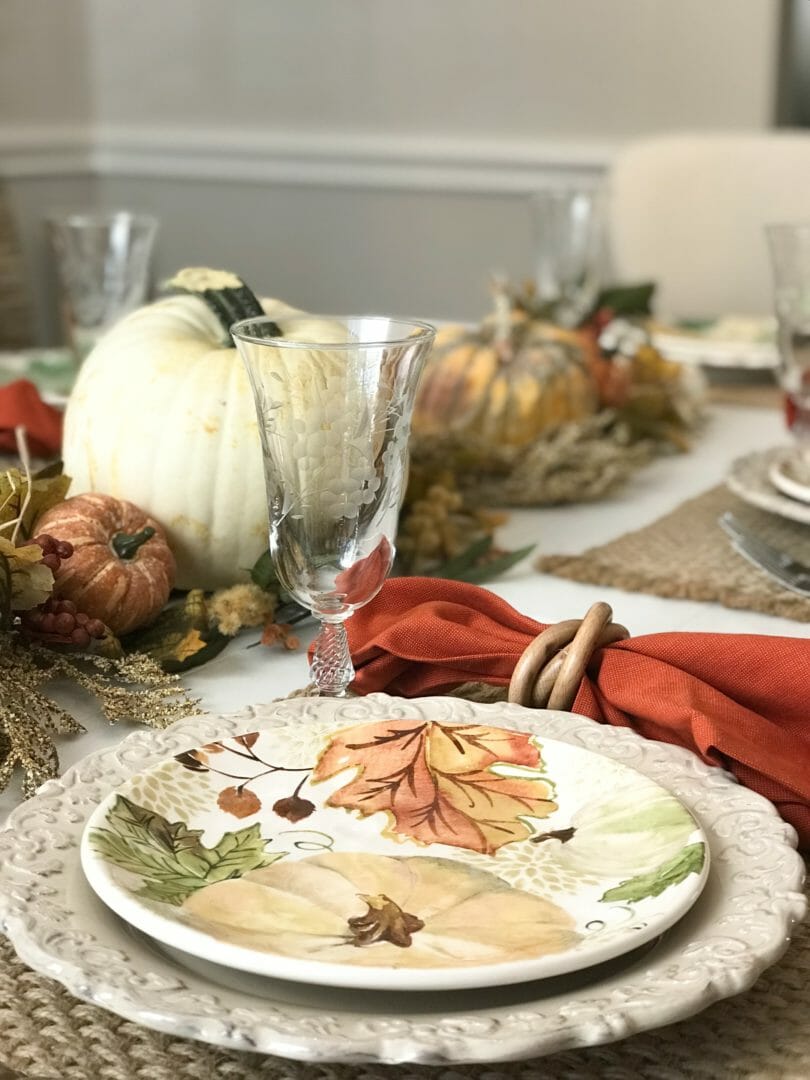 fall plates with pumpkn and centerpiece