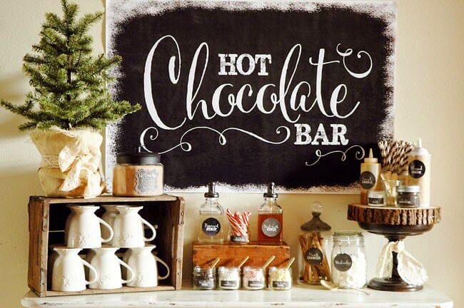 hot cocoa bar with chalkboard and cups