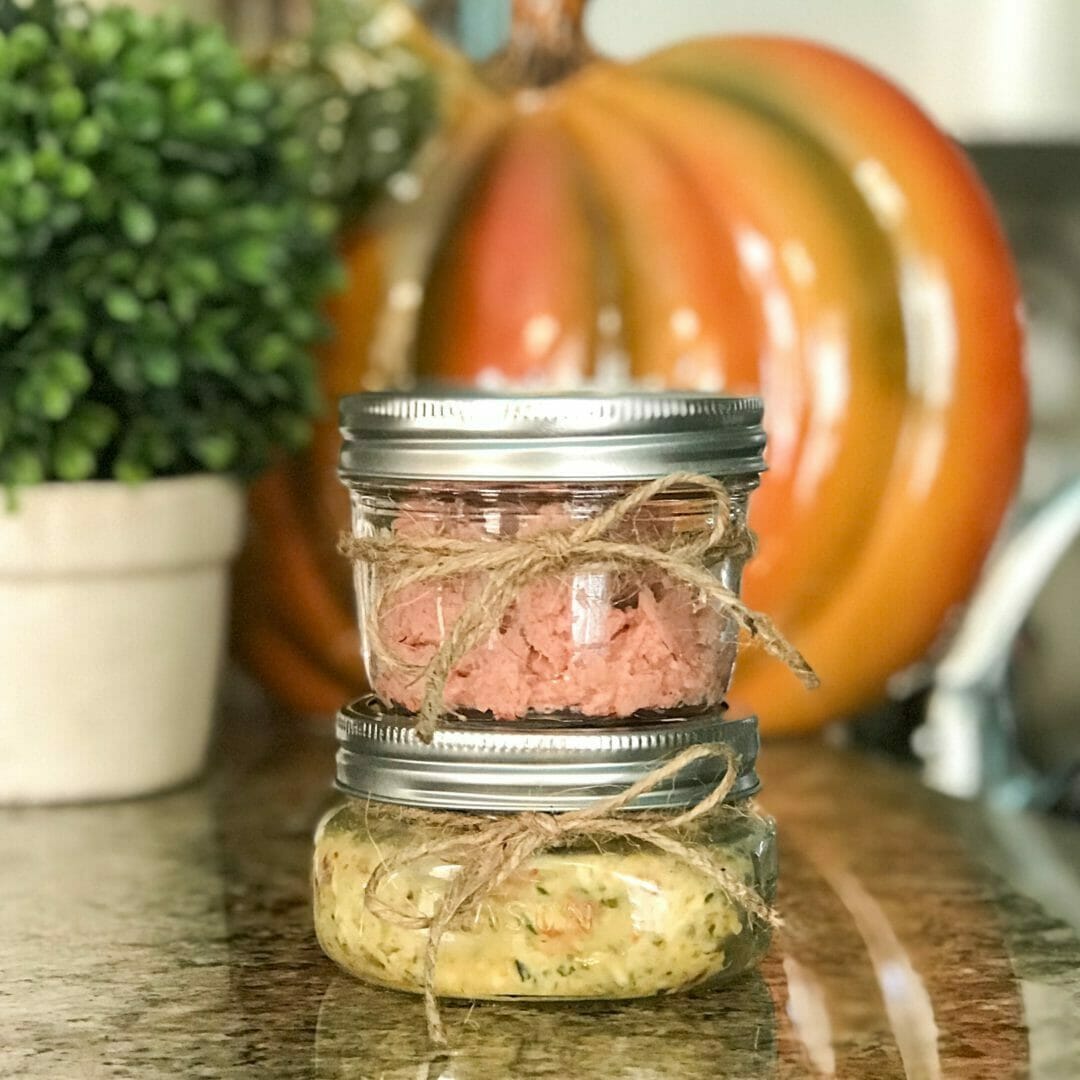 stacked jars of butters with pumpkin in background