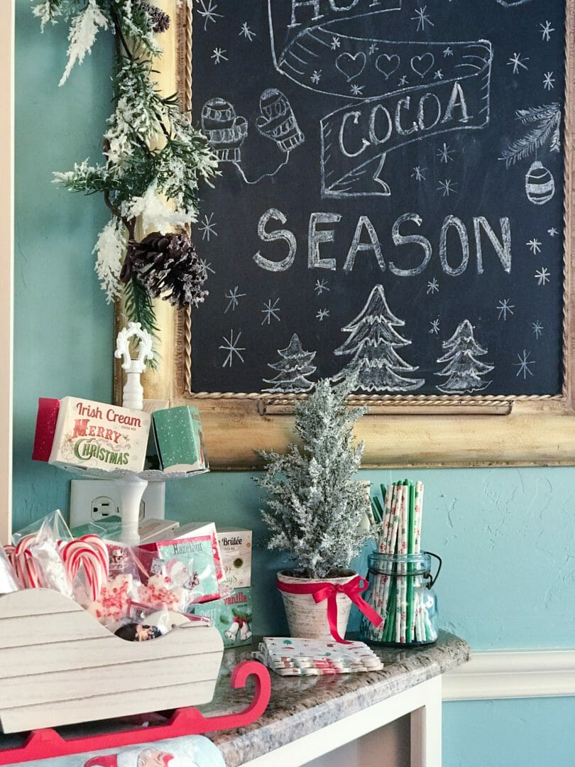 hot cocoa bar with chalkboard, tree, and straws