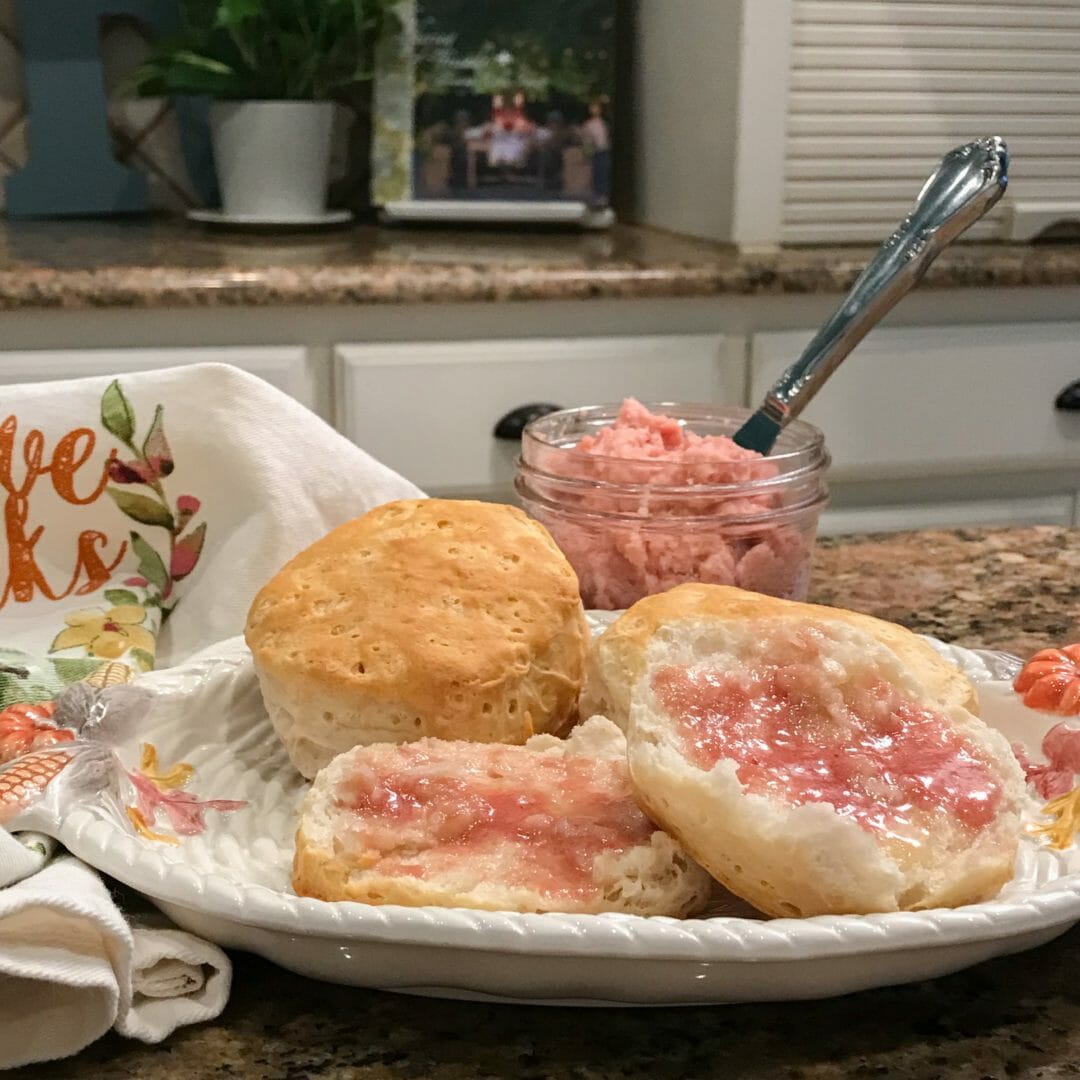 plate of cut bisquit with butter and knife