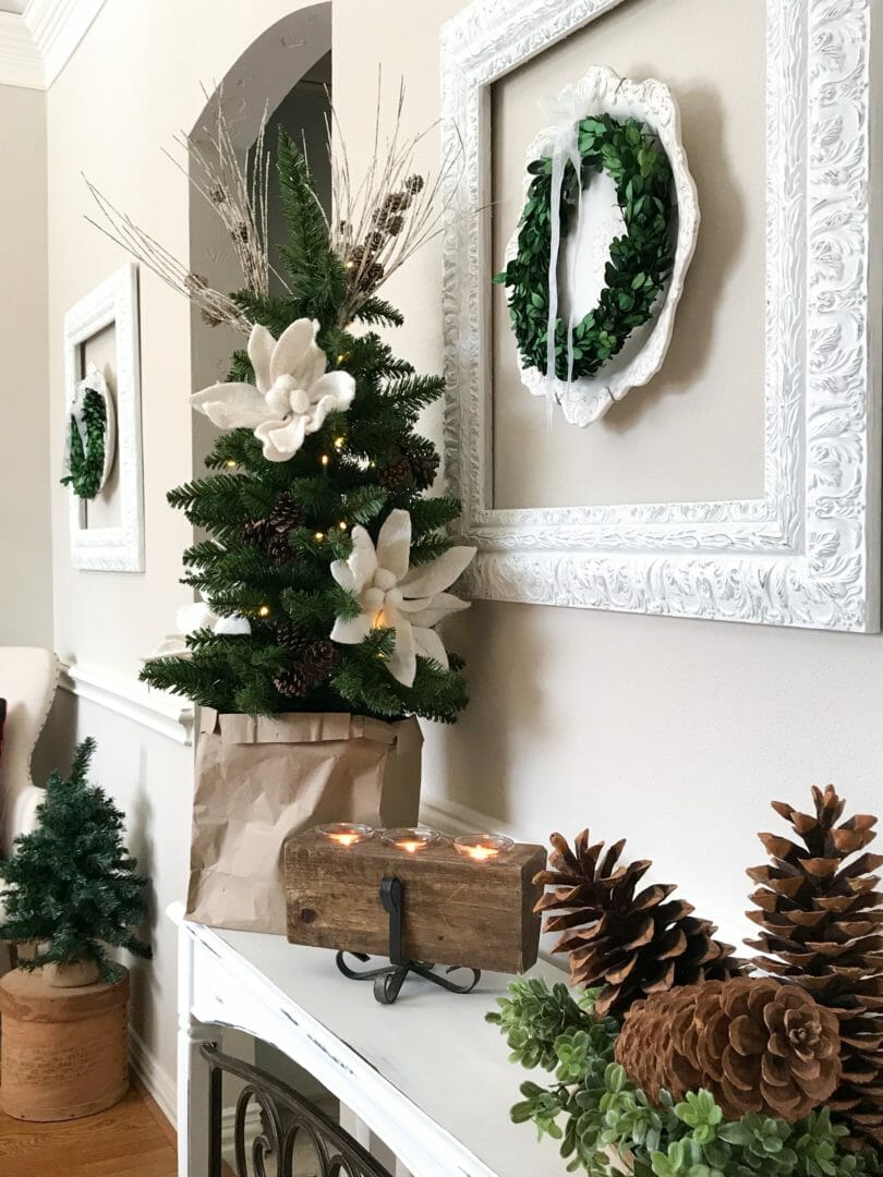 3 foot tree with cnadle, pine cones and wall decor