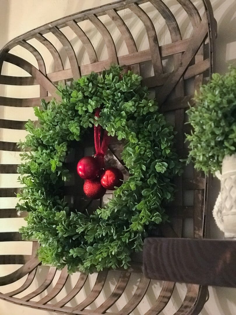 tobacco basket with boxwood wreath and red ornaments