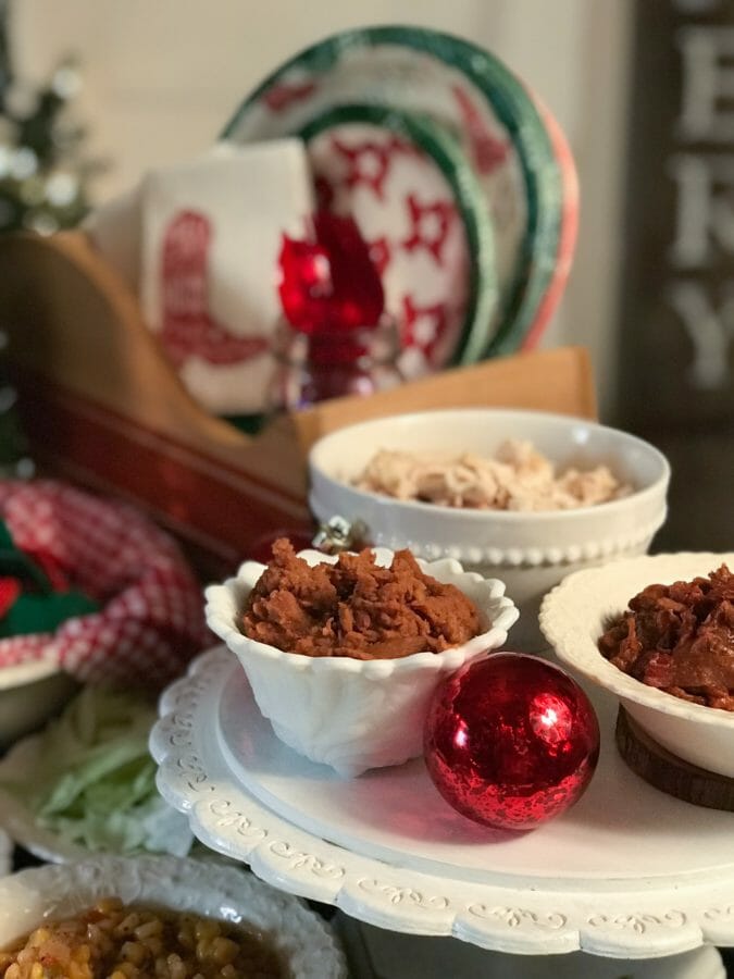 close up of cake place with food and one red christmas ball