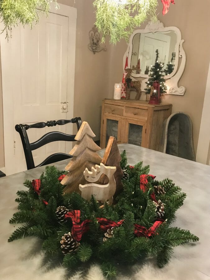 garland as wreath with cabinet and mirror