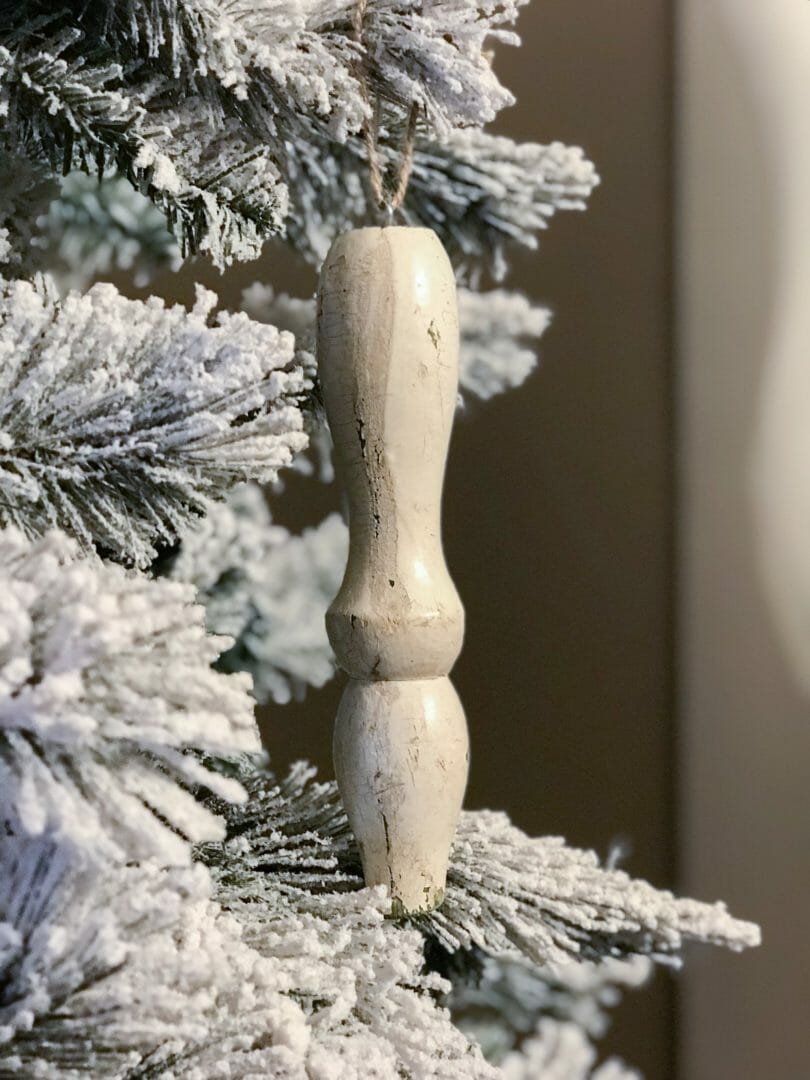 repurposed leg ornament hanging on tree