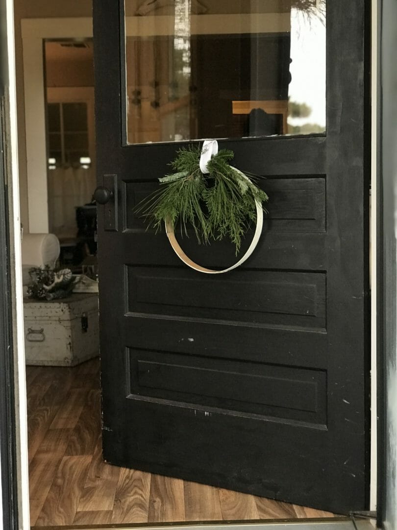 repurposed wreath hanging on bottom of front door