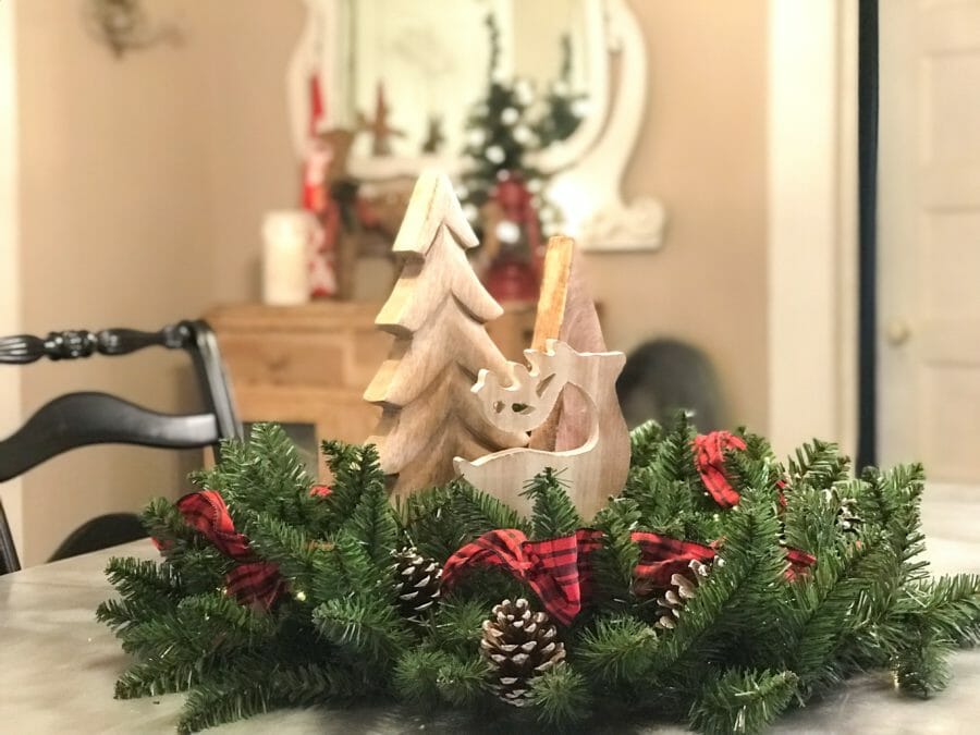 garland as wreath with wooden trees in middle