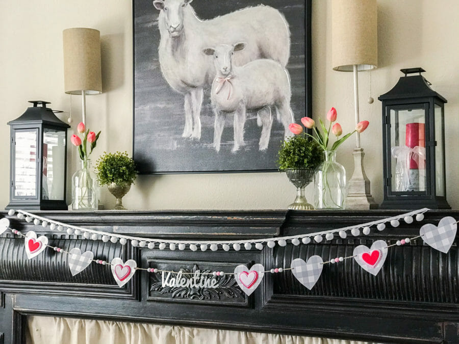 view of mantel with lambs and valentine garland