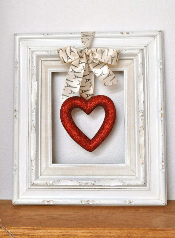 white frame with red heart inside